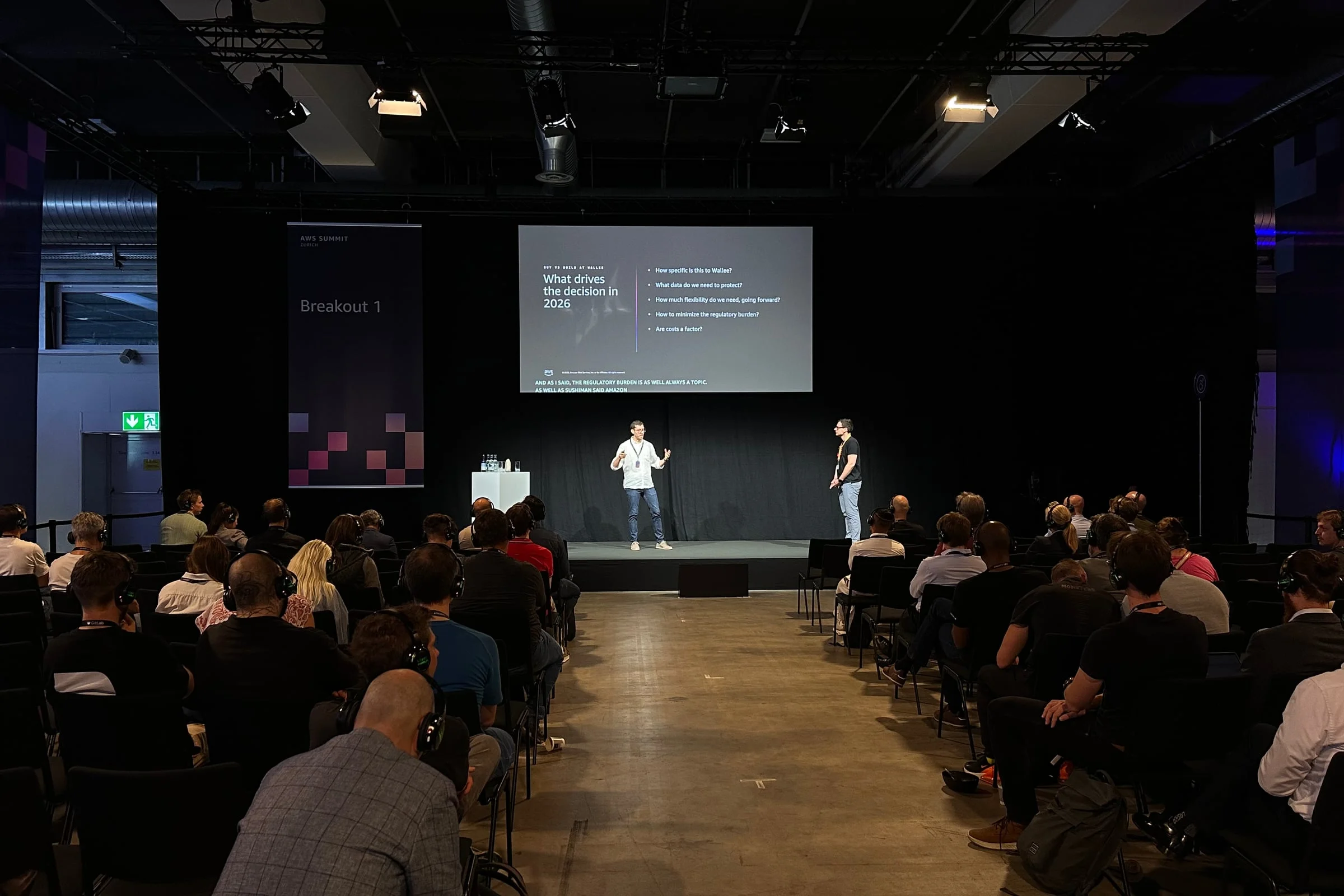 The Breakout 1 room at AWS Summit Zurich, with Wallee presenting to the audience.